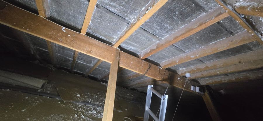 Spray foam insulation removed from roof rafters by MG SOURCE
